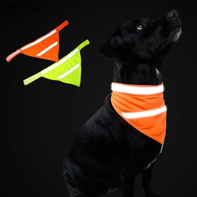 Yellow and orange reflective striped dog bandana with adhesive strap, shown on a dog's neck.