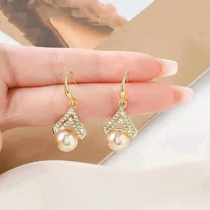 Water Drop Pearl Earrings in gold, white, and champagne with geometric design