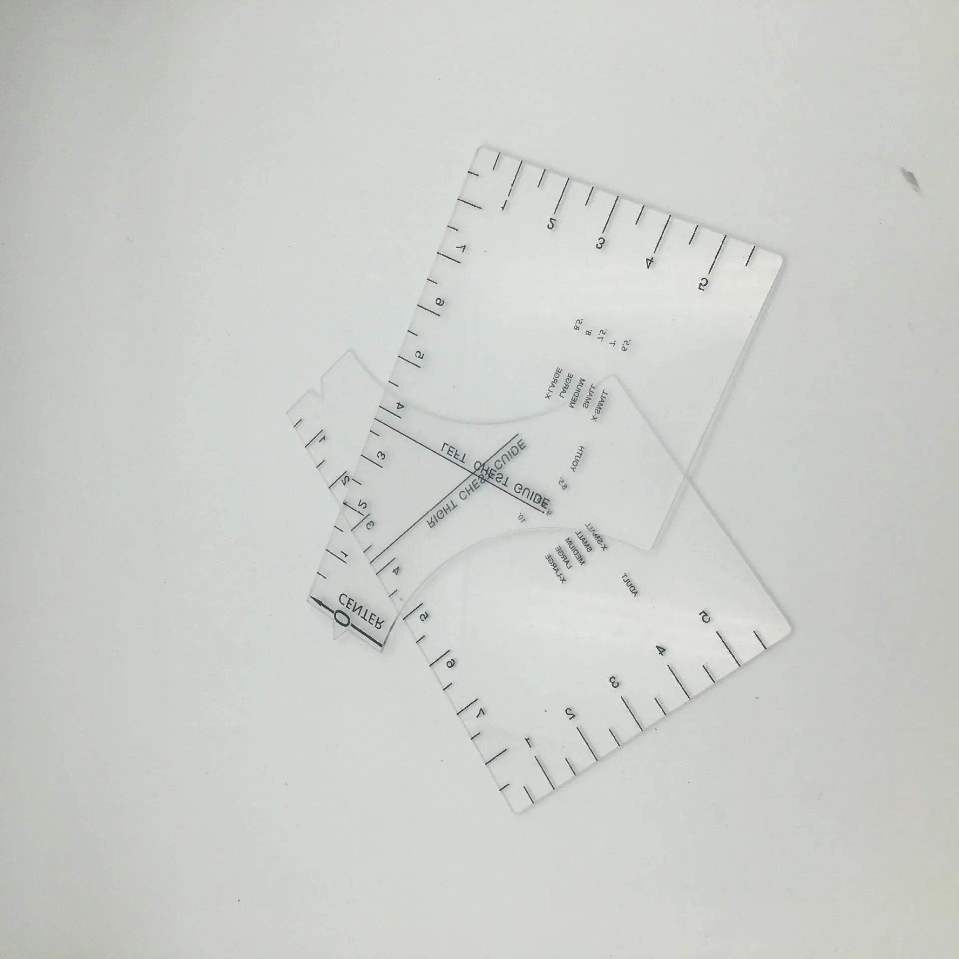 Transparent acrylic sewing ruler patch for T-shirt alignment, 10x6 inches.