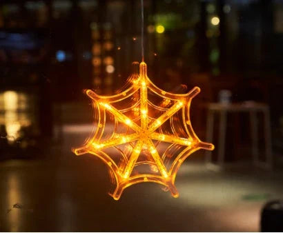 Spooky Halloween window hanging lights featuring pumpkins, spiders, and ghostly figures for a festive atmosphere