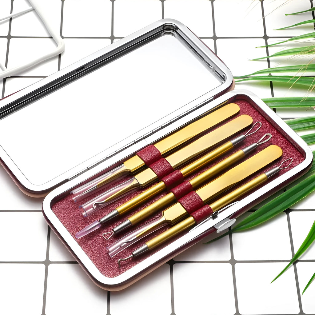 Six rose gold stainless steel acne removal tools arranged on a clean surface
