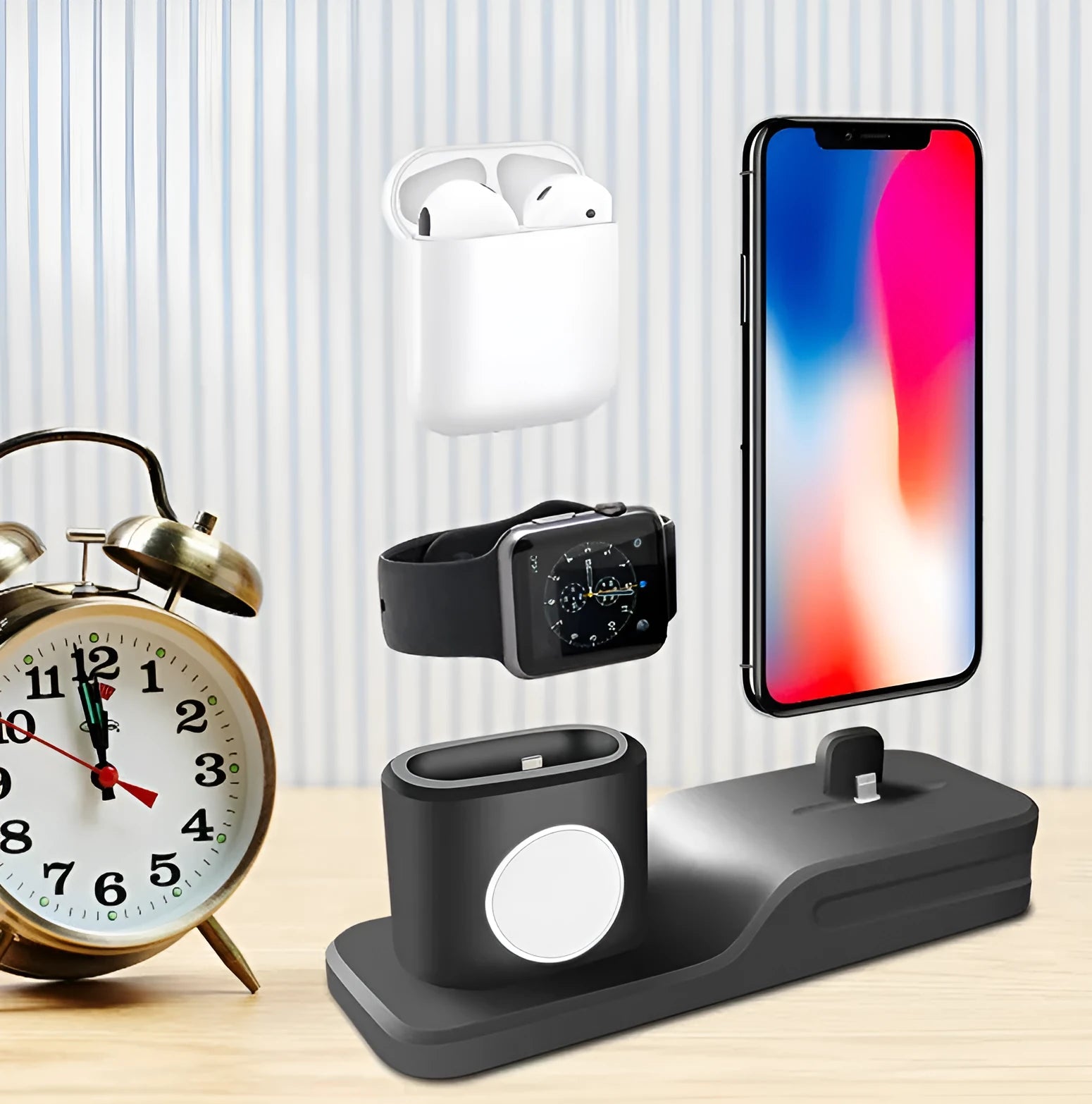 Black geometric 3-in-1 charging stand for Apple iPhone, Watch, and AirPods on a desk.