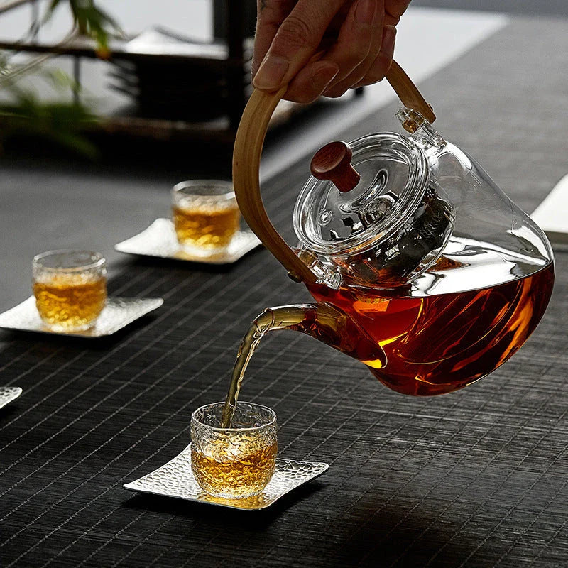 Japanese style glass bamboo handle teapot kettle on a wooden table