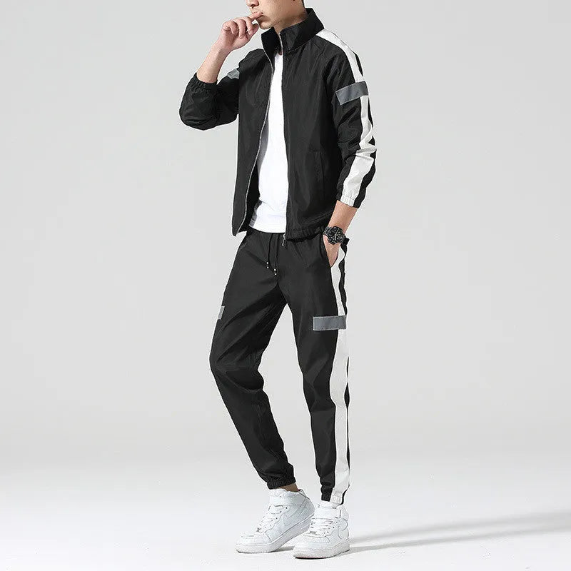 Reflective track suit in black polyester with reflective strips, front view