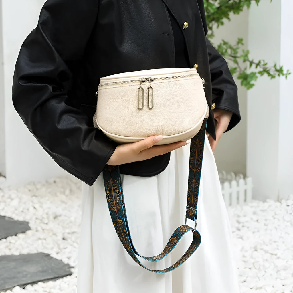 Women's saddle-shaped PU leather messenger bag with single shoulder strap in black, white, or green colour options
