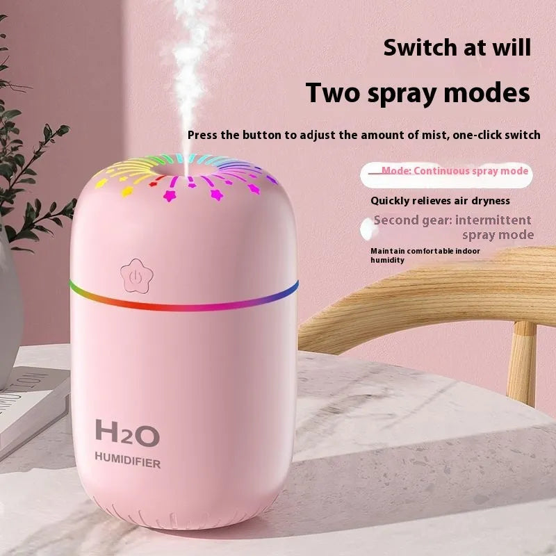 Compact white USB humidifier with 300ml tank beside laptop showing dimensions