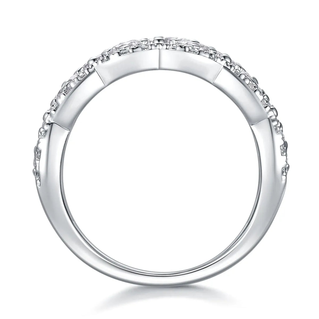 Lace Snowflake moissanite wedding ring set in S925 silver with platinum plating on a black background