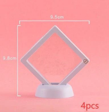 3D floating jewelry display stand showcasing earrings and coins in mid-air