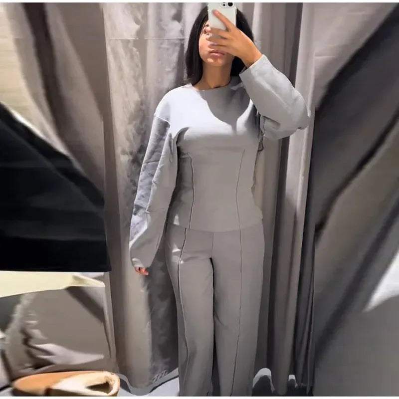 Women's apricot coloured polar fleece suit set featuring a pleated long sleeve top and wide leg trousers