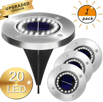 8LED waterproof solar garden light staked in lawn with warm glow, IP65 rated for rain resistance