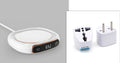 USB-powered white coffee mug warmer with ABS base and metal heating plate on wooden desk