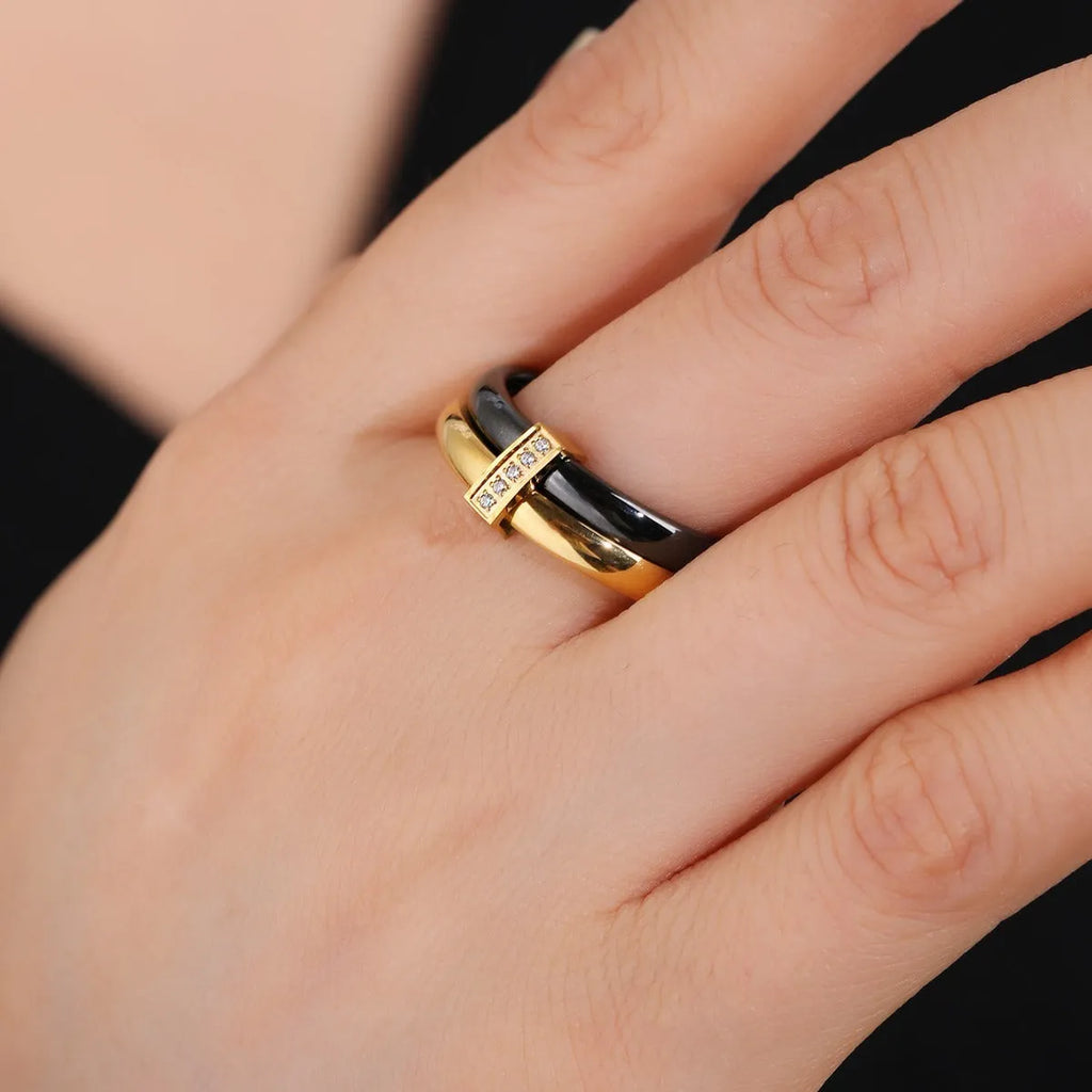 Heart shape titanium steel women's ring with double band, glossy stitching, and inlaid zirconium stones.
