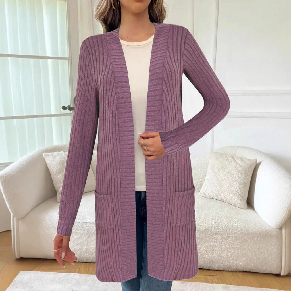 Black loose fit knitted cardigan jacket with long sleeves and side pockets on a mannequin.