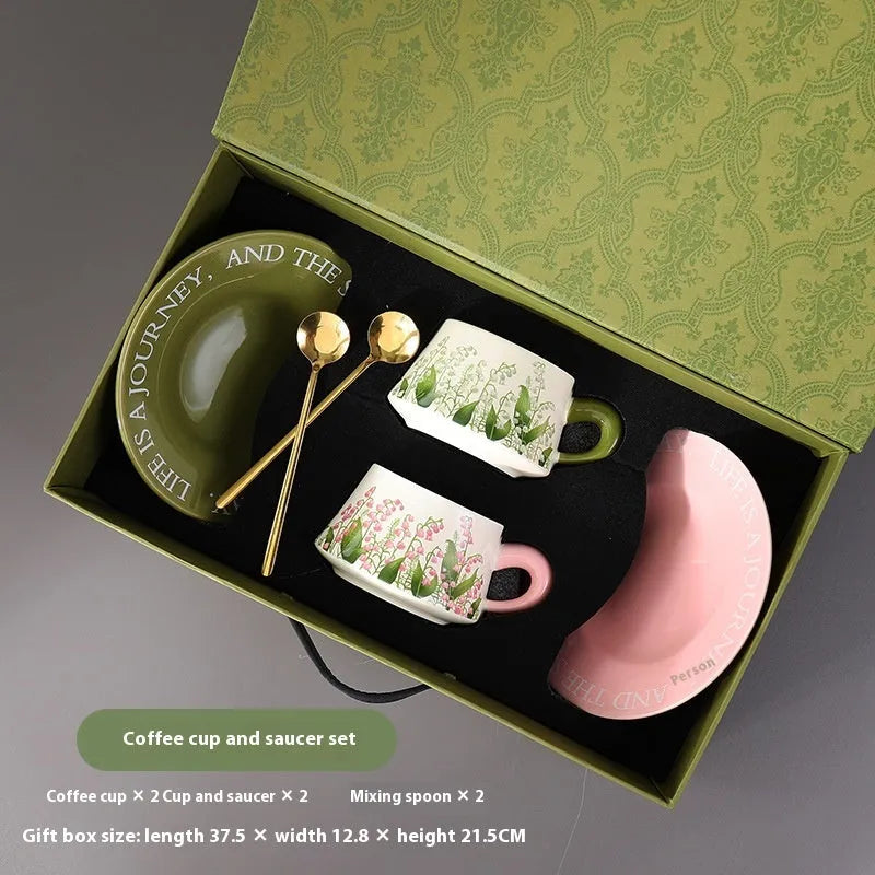 Ceramic coffee cup and saucer set with two mugs, plates, and spoons in couple designs
