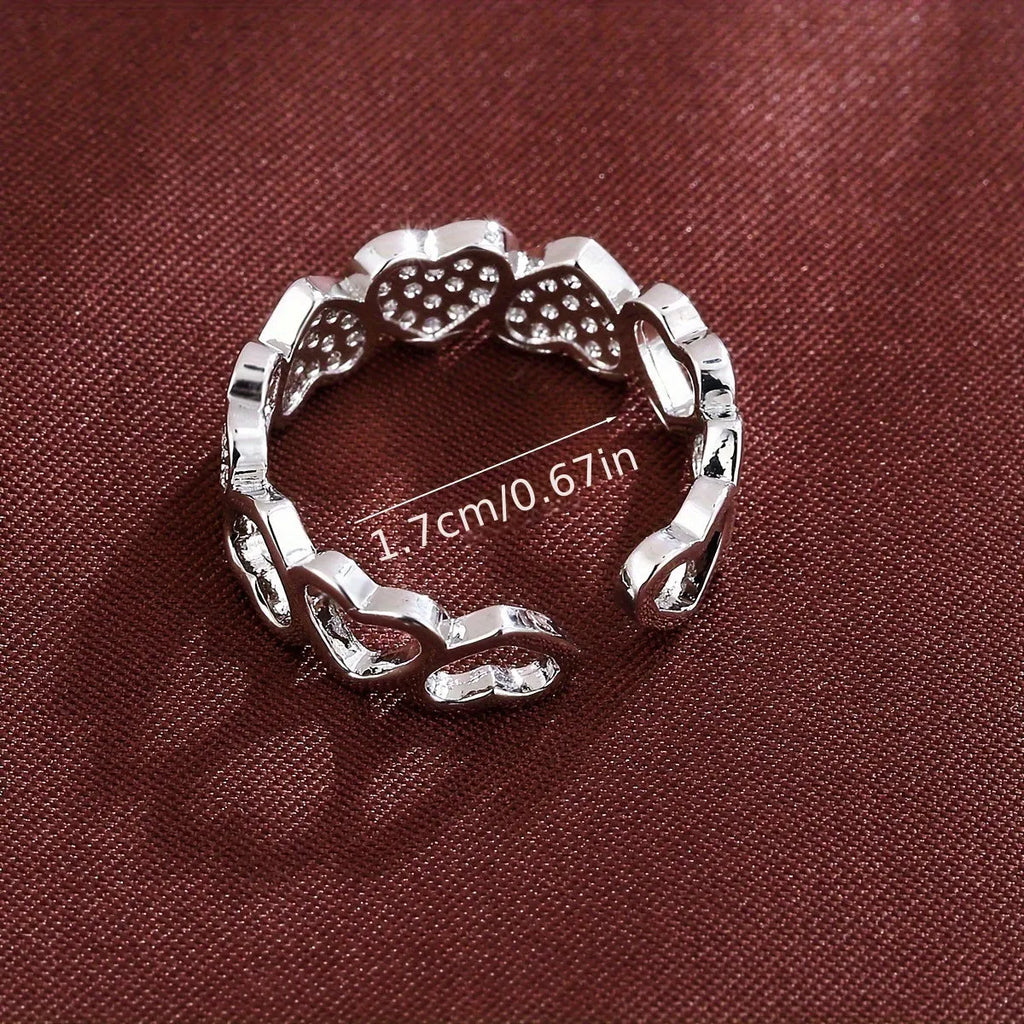 Adjustable geometric copper couple ring with love heart detail in gold or silver colour.