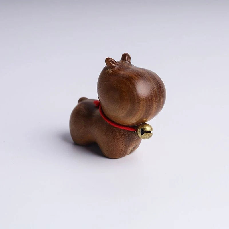 Handcrafted sandalwood kitten ornaments in various styles and colours