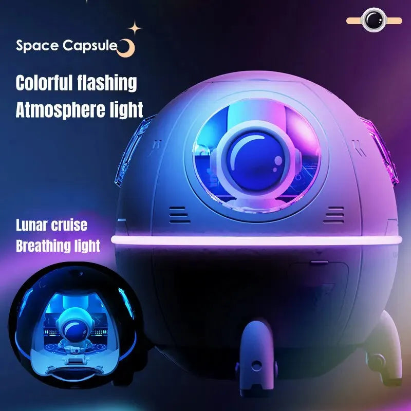Astronaut-shaped USB desktop humidifier with colourful LED light on a desk.