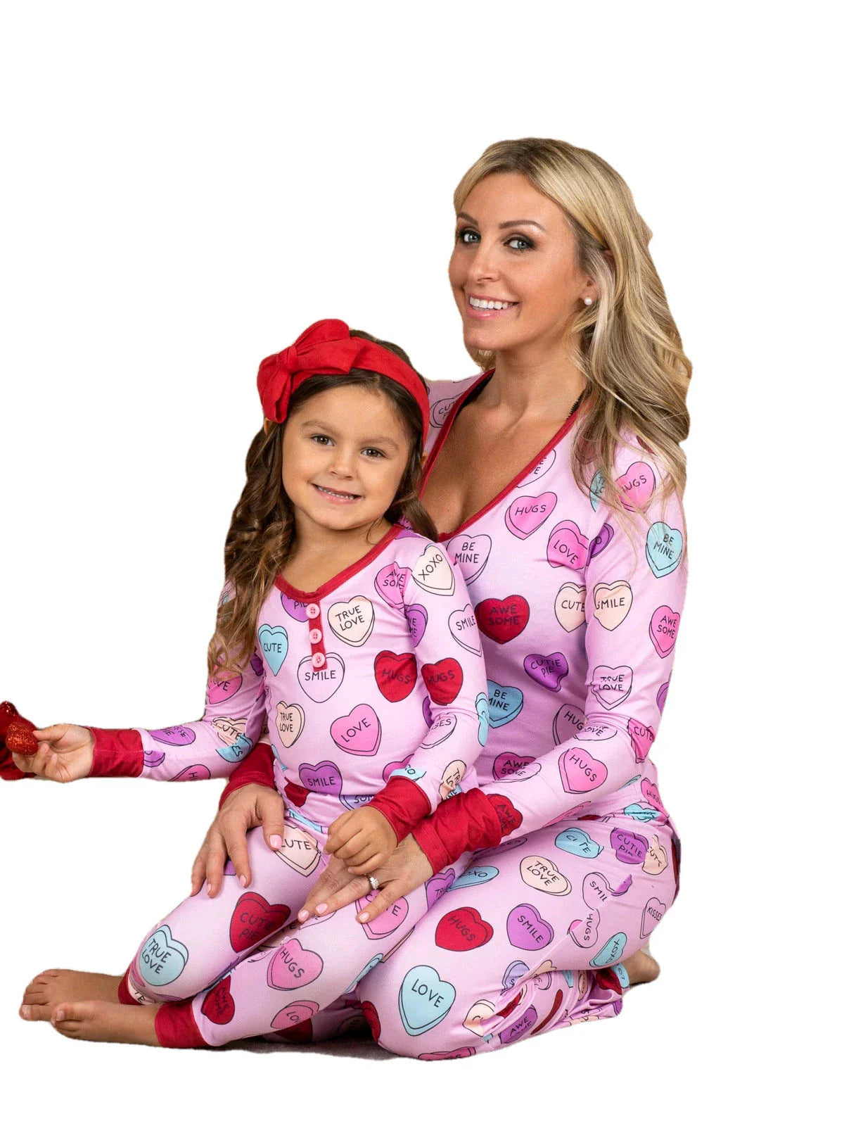 Valentines Day family pajamas with a cozy heart print design for parents and children