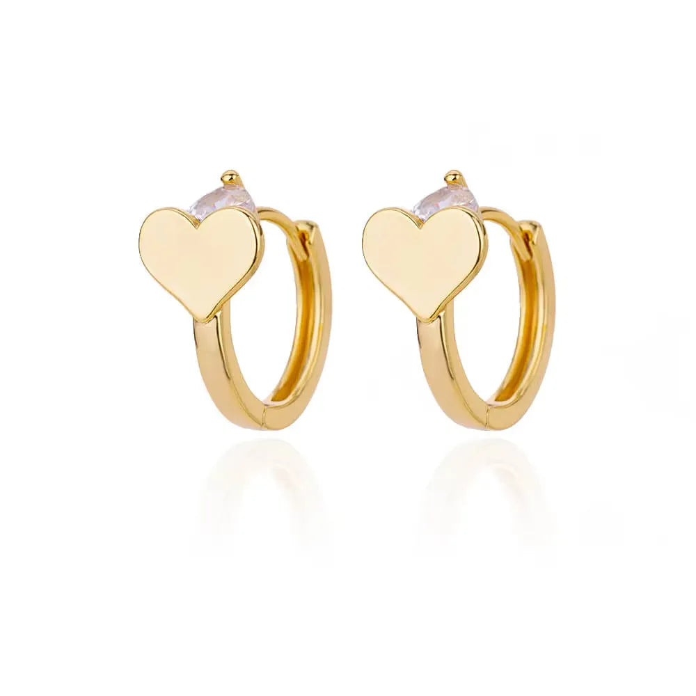 Gold heart-shaped zircon stud earrings with a clip back fastening for women.