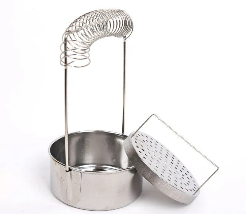 Silver stainless steel oil painting pen washer with a brush clamped at the rim