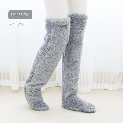 Cozy over-the-knee fuzzy socks in various colors, designed to keep your legs and knees warm during the winter season.