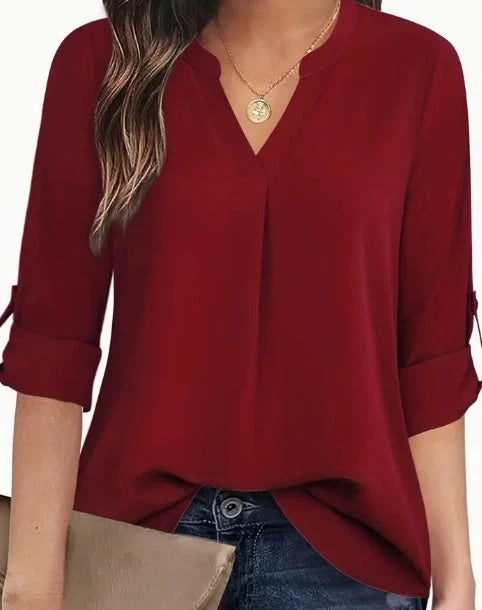 Women's V-neck blouse in 100% polyester, available in burgundy, apricot, and black