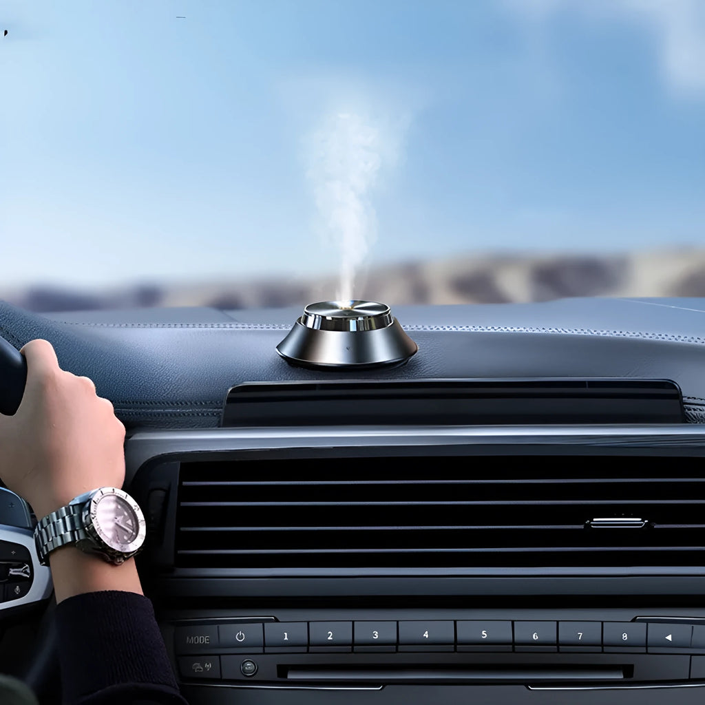 Black butterfly-shaped metal car aromatherapy diffuser with USB cable and essential oil bottle