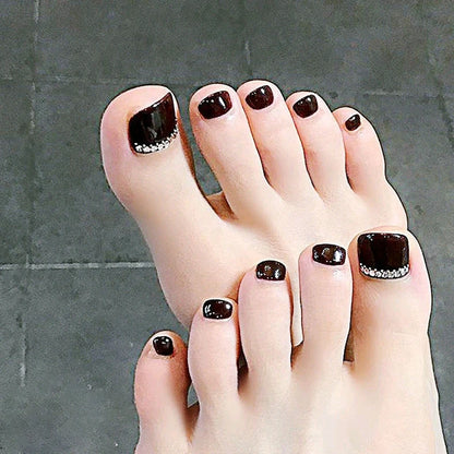 Black rhinestone toe nail patches with geometric and floral designs on adhesive backing