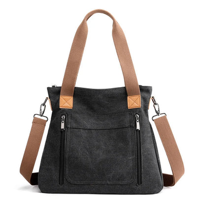 Women's canvas shoulder bag in multiple colours, showcasing spacious interior and zipper closure.