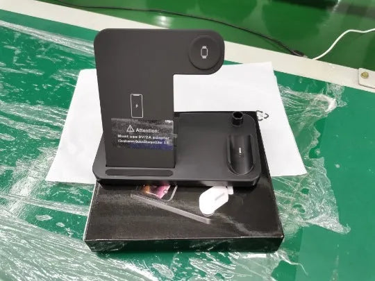 Black folding 4-in-1 wireless charger showing vertical stand for iPhone and flat charging pad.