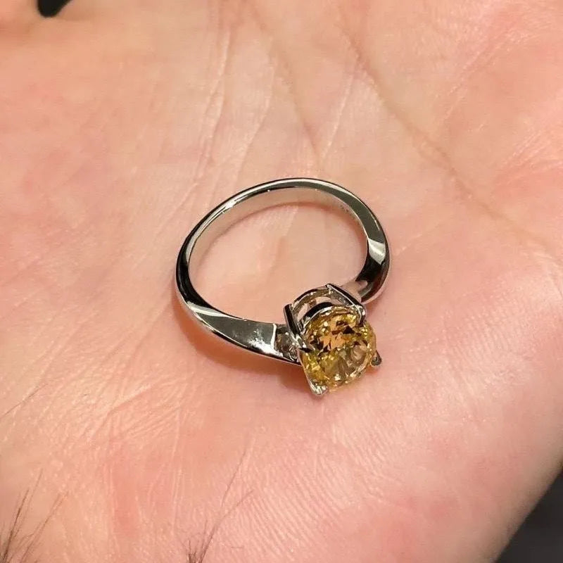 Yellow rock sugar crystal colour copper ring for women on a ring stand.