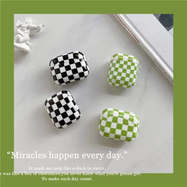 Black and green checkerboard lattice pattern TPU hard shell case covers for AirPods with optional lanyard and pendant attachments.