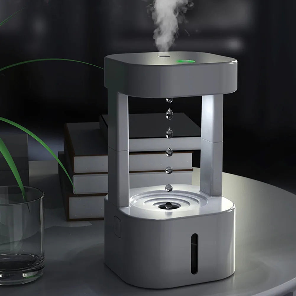 White anti-gravity water drop humidifier with coloured lights and USB cable
