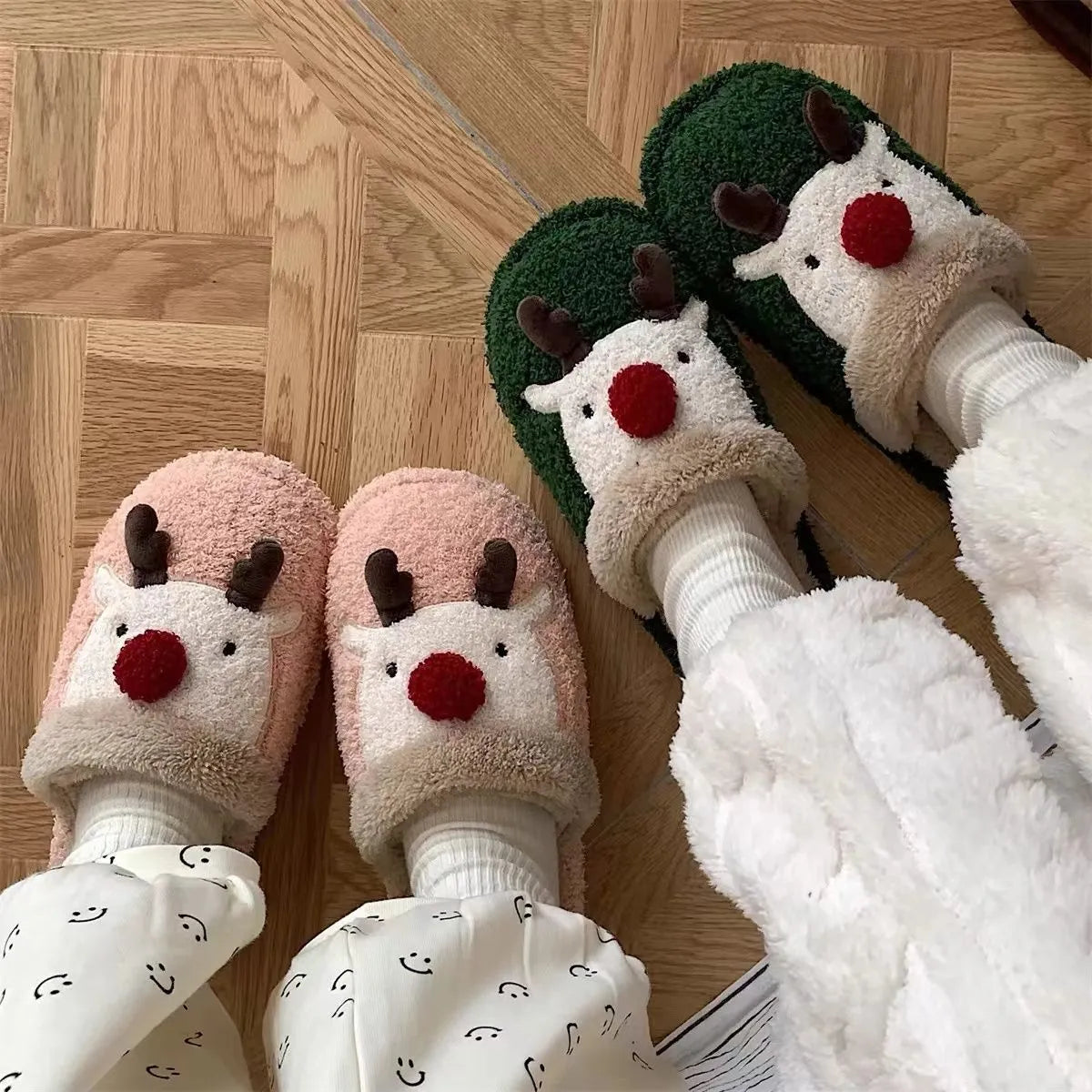 Women's green plush Christmas elk slippers with non-slip PVC sole, shown on a white background.