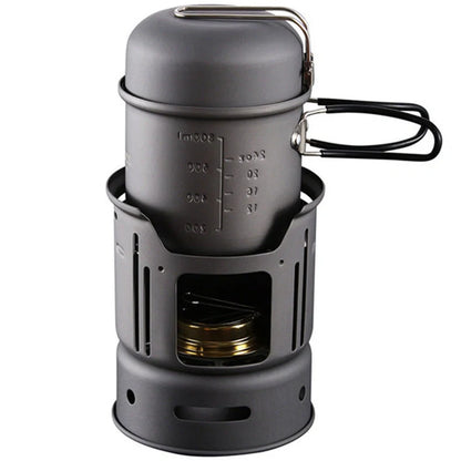 Small black stainless steel camping cookware set with alcohol stove and components