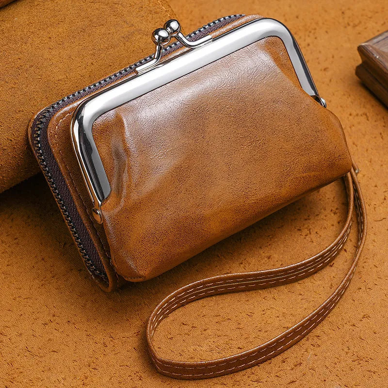 Ladies' small black buckle coin purse with a clip closure, shown closed, measuring 4 inches.