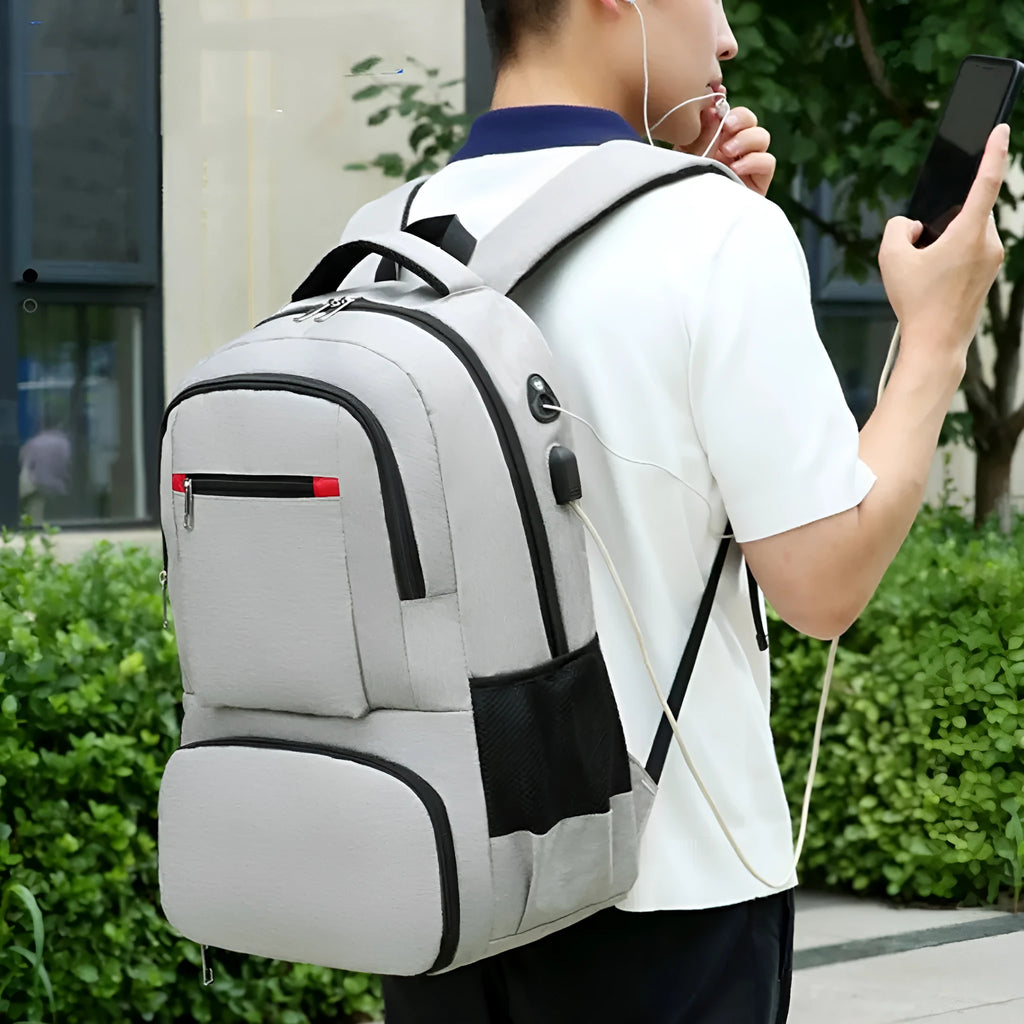 Light grey insulated Oxford cloth backpack with curved shoulder straps on a neutral background.