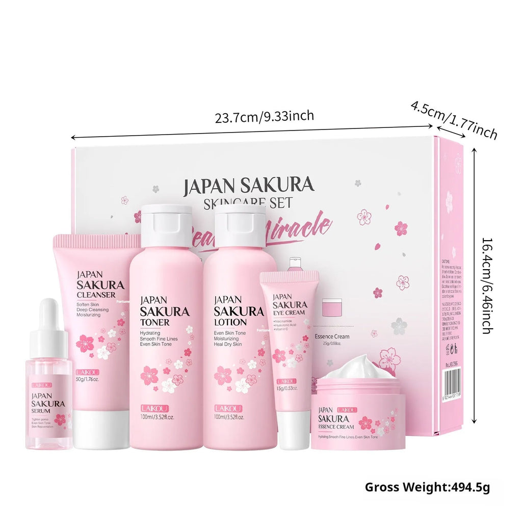 Boxed Cherry Blossom 6-piece skincare set showing cleanser, toner, creams, and serum.