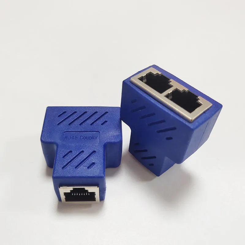 White RJ45 three-way network cable splitter adapter with one input and two output ports.