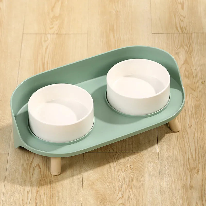 Green adjustable pet bowl set with tilted double compartments for food and water feeding
