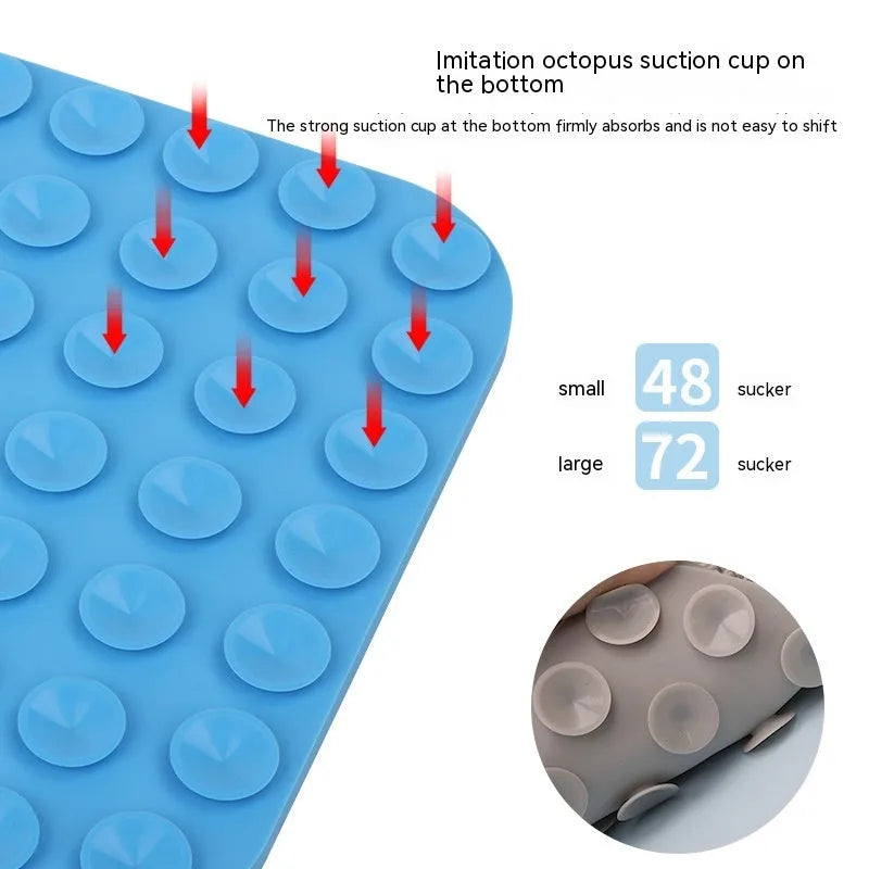 Gray silicone anti-choke slow feeding dog licking pad with textured surface on a flat surface