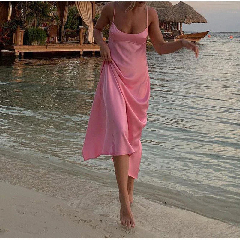 Elegant sleeveless slip maxi dress in pink with backless design and figure-flattering silhouette