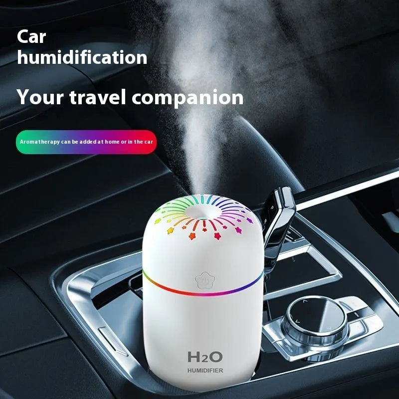 Compact white USB humidifier with 300ml tank beside laptop showing dimensions