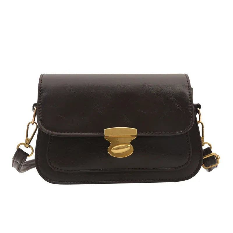 Small soft PU leather square handbag in retro design, shown in a neutral colour.
