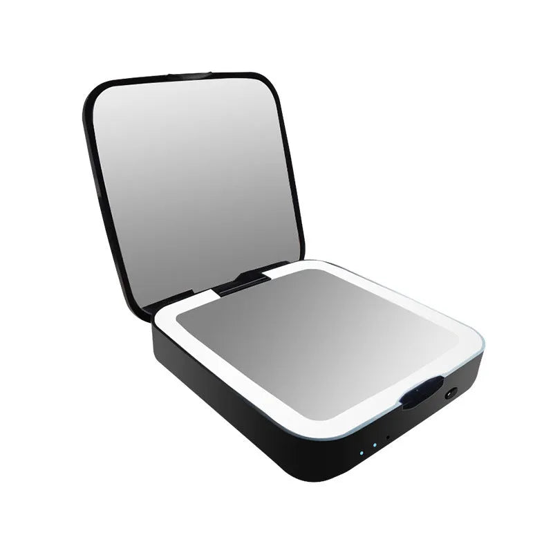 Black and white makeup mirror showing a magnifying side and a normal mirror with LED light ring.
