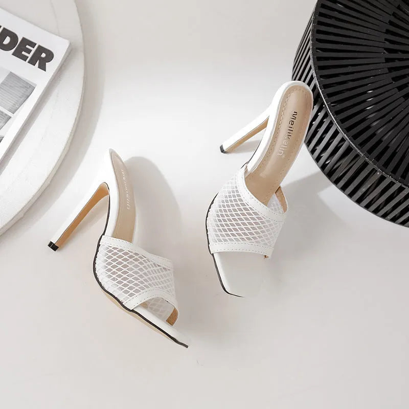 Women's white fish mouth sandals with leather insole and side air detail, side view