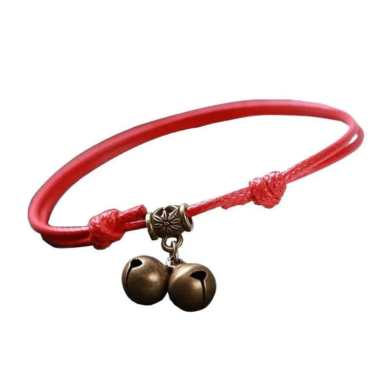 Adjustable nylon dog collar with brass buckle and optional brass bell in black, red, or coffee rope.