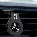 Magnetic car phone holder mounted on air vent with smartphone attached and fragrance slices