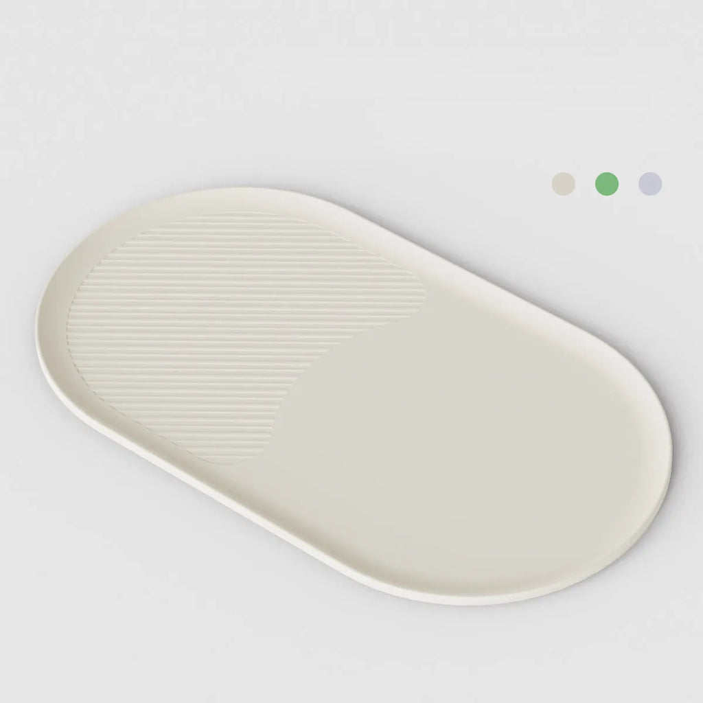 Pet mat for cats and dogs with green silicone non-slip base and 304 stainless steel bowl on a tiled floor