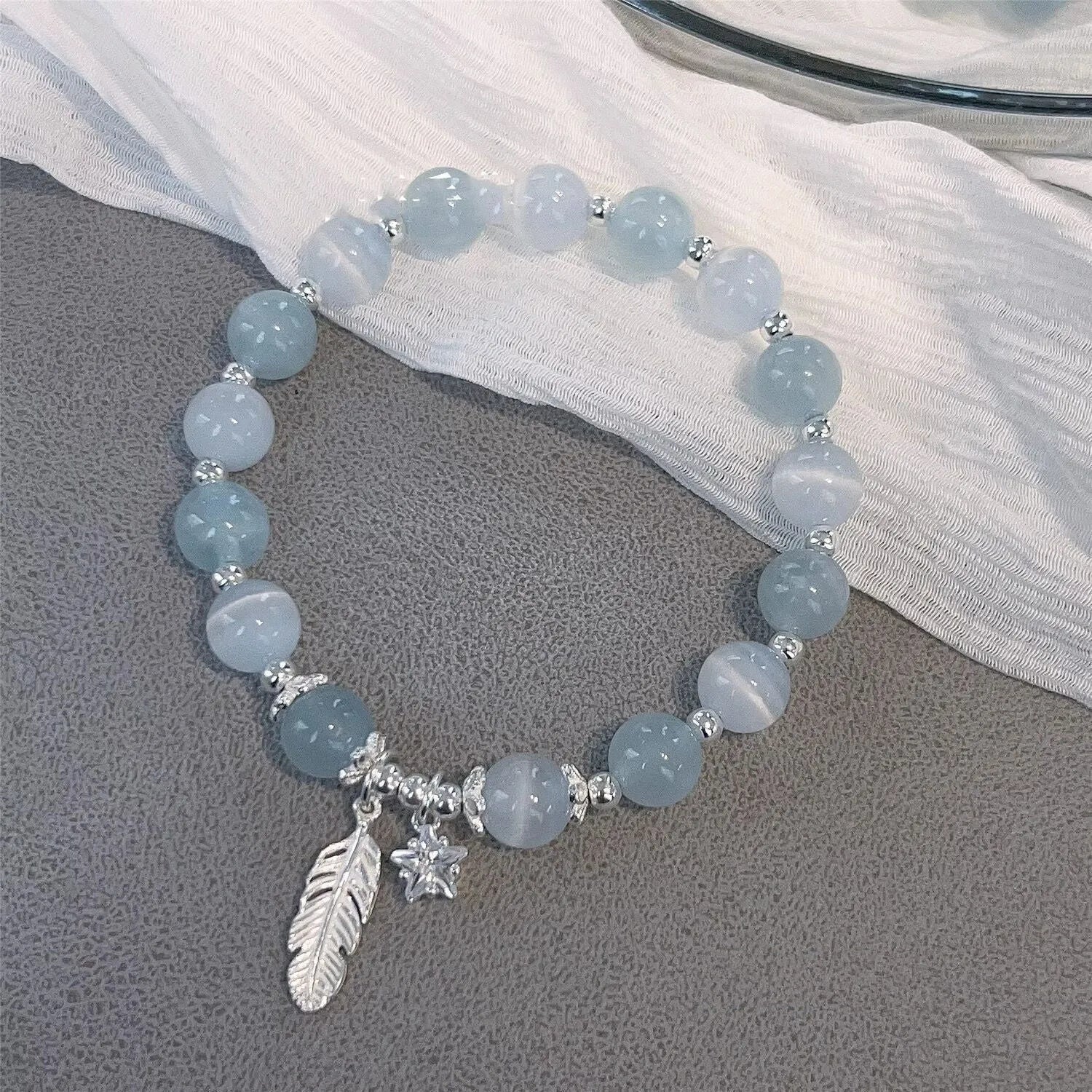 Korean style crystal bracelet with blue moonlight glass beads and eight pointed star charm